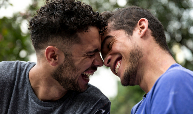 two gay men laughing having fun