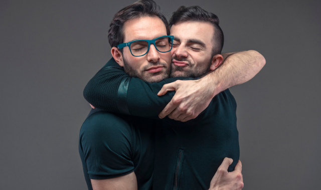 concept of demisexuality - two men hug tightly